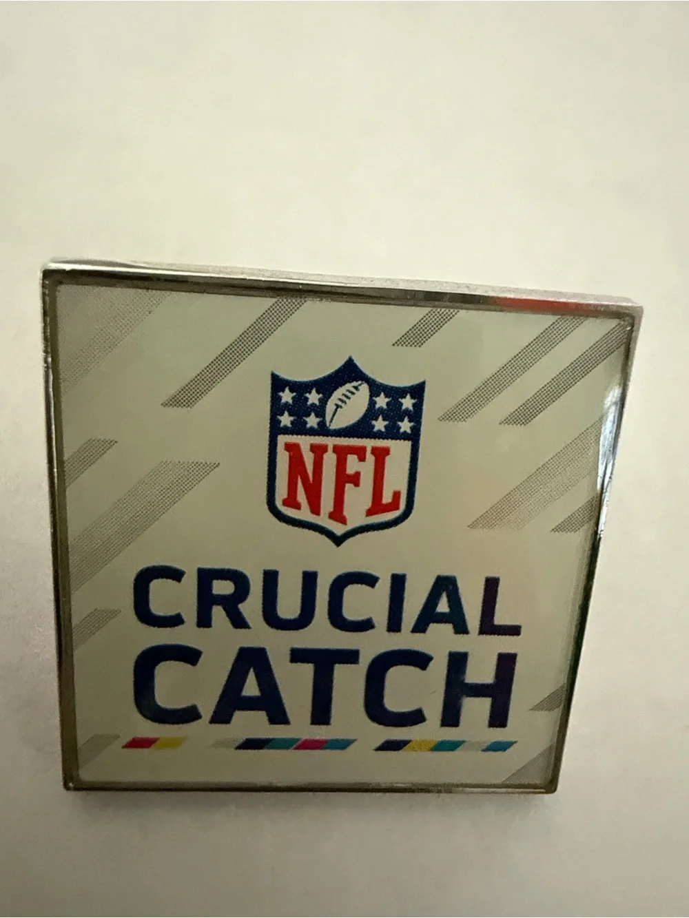 NFL Crucial Catch Brooch in White and Blue with Accent Stripes